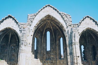 Low angle view of cathedral against clear blue sky