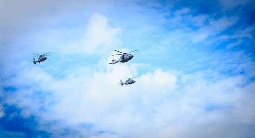 Low angle view of airplane flying in sky