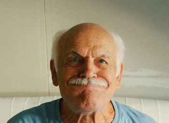 Portrait of senior man at home