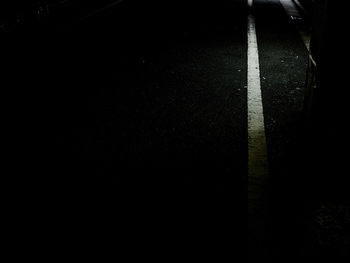 Full frame shot of empty road at night