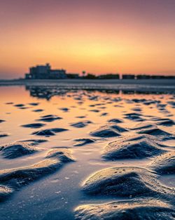 Scenic view of sea against clear sky during sunset