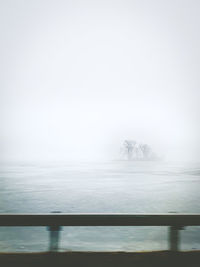 Scenic view of sea against sky during winter