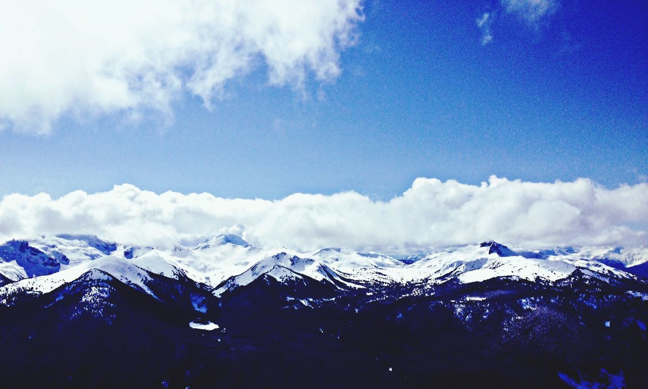 snow, winter, cold temperature, mountain, tranquil scene, snowcapped mountain, scenics, season, mountain range, tranquility, beauty in nature, sky, weather, nature, landscape, cloud - sky, covering, blue, non-urban scene, cloud