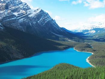 High angle view of lake by snowcapped mountains during winter