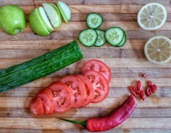 High angle view of fresh vegetables and fruits on cutting board