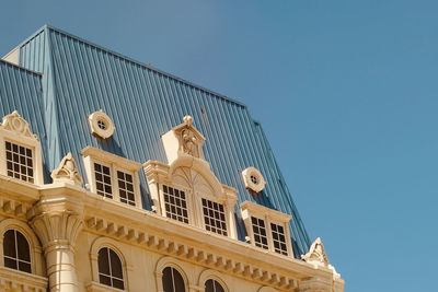 Low angle view of historic building against clear blue sky