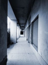 Empty corridor along buildings