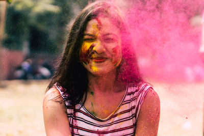 Close-up portrait of woman covered with powder paint