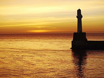 Scenic view of sea at sunset