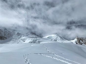 Snow covered mountain against sky