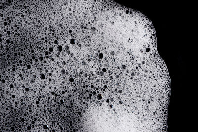 Close-up of coffee over black background