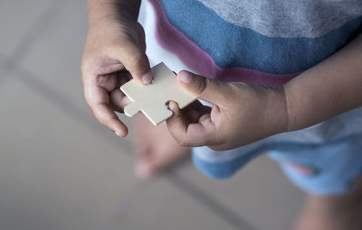 High angle view of man holding hands