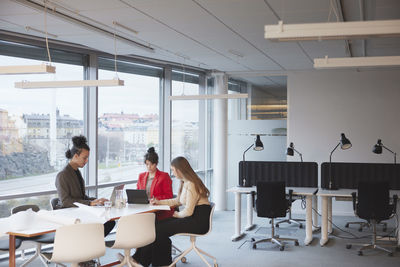 People having meeting in office