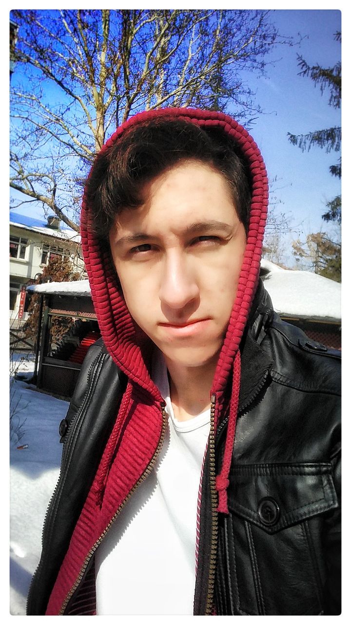 winter, clothing, warm clothing, one person, portrait, young adult, real people, front view, cold temperature, lifestyles, headshot, day, leisure activity, jacket, looking at camera, hood, scarf, young men, hood - clothing, outdoors