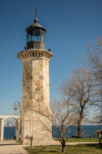 Low angle view of lighthouse against blue sky