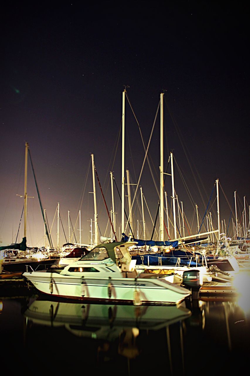 nautical vessel, transportation, mode of transport, moored, boat, water, mast, clear sky, copy space, sailboat, harbor, sea, night, travel, blue, in a row, nature, no people, outdoors, yacht