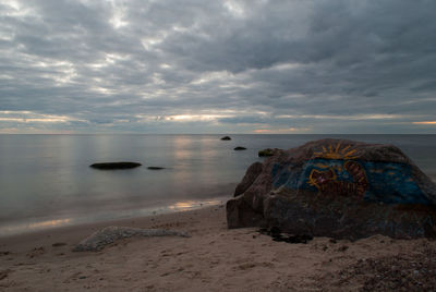 Scenic view of sea against cloudy sky