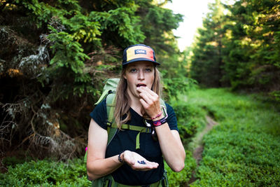 Portrait of young woman wearing hat