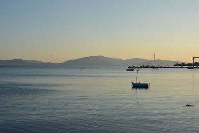 Scenic view of sea against clear sky during sunset