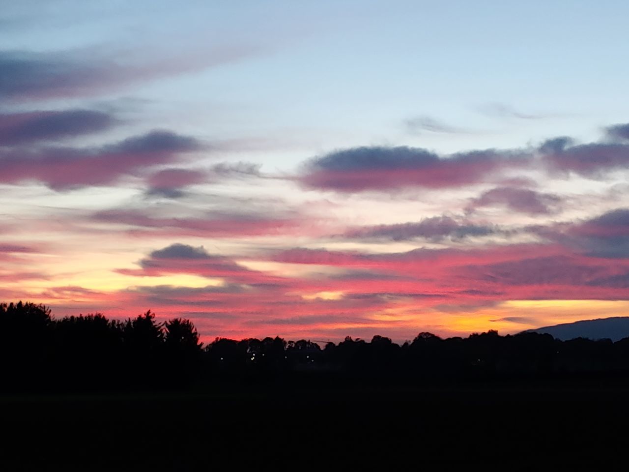 sky, sunset, beauty in nature, cloud - sky, silhouette, scenics - nature, tranquil scene, tranquility, orange color, nature, tree, non-urban scene, idyllic, environment, no people, landscape, plant, outdoors, dramatic sky, land, romantic sky