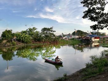 Boat in lake against sky