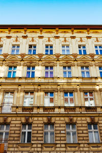 Low angle view of building against blue sky