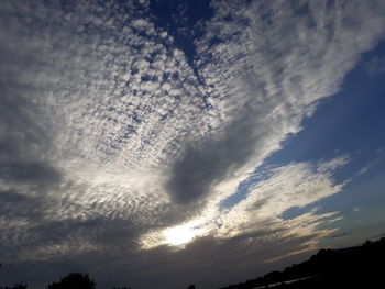 Low angle view of dramatic sky during sunset