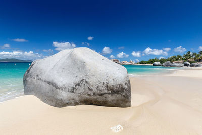 Sea shore against blue sky