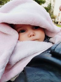 Close-up portrait of cute baby in winter