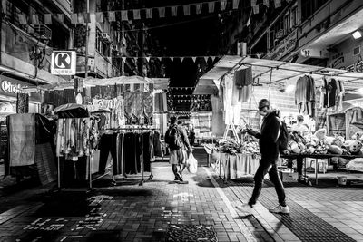 People walking on street at night