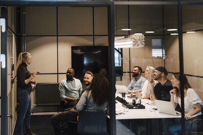 Coworkers having meeting in office