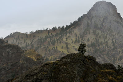 Rock formations on mountain against sky