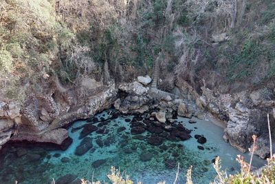 High angle view of rocks in sea