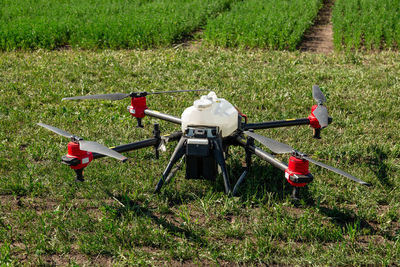 Agriculture drone fly to sprayed fertilizer on the fields. industrial agriculture and smart farming