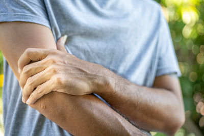 Close-up of man holding hands