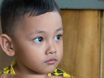 Close-up of boy looking away