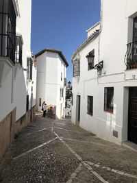 Street amidst buildings against sky