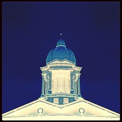 High section of built structure against clear blue sky