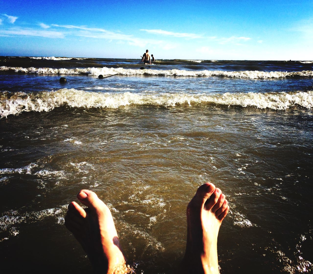 water, low section, person, sea, lifestyles, leisure activity, barefoot, beach, personal perspective, human foot, vacations, shore, standing, relaxation, scenics, sky