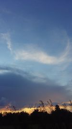 Scenic view of landscape against cloudy sky