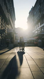 Silhouette of woman walking in city