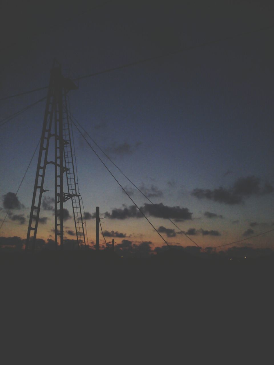 silhouette, sky, sunset, electricity pylon, low angle view, fuel and power generation, electricity, dusk, tranquility, nature, power line, scenics, tranquil scene, connection, technology, beauty in nature, landscape, cloud - sky, outdoors, power supply