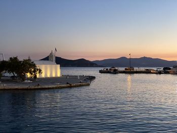 Scenic view of sea against clear sky at sunset