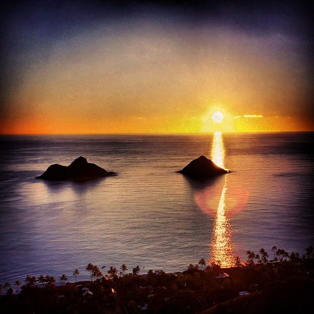 sea, sunset, horizon over water, water, sun, scenics, tranquil scene, beauty in nature, tranquility, orange color, idyllic, reflection, sky, rock - object, nature, beach, silhouette, shore, ocean, sunlight