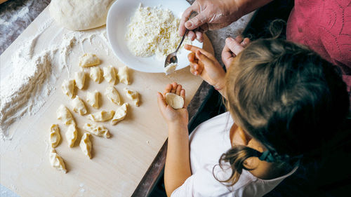 High angle view of woman preparing food