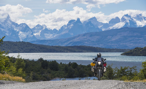 Man riding his touring motorbike at torres del paine, patagonia
