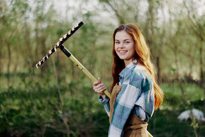 Portrait of smiling holding farmer rack