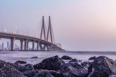 Bridge over sea against sky