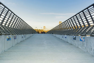 Pedestrian walkway against sky