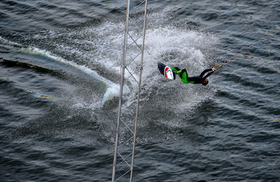 Man kiteboarding in sea